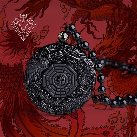 Pingente em obsidiana negra com Yin-Yang no centro e as áreas do ba guá